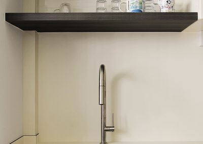 A classic approach for a new family with an open concept communal space. Polished terazzo flooring with a splash of green to bring out that retro feel.